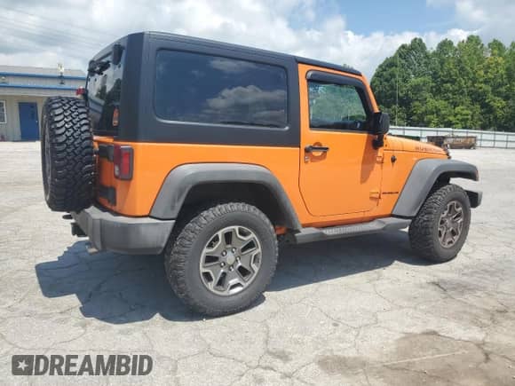 2013 Jeep Wrangler Rubicon 10th Anniversary with VIN 1C4BJWCG0DL526182, listed as a Copart auction lot 64806935 with 25,007 mi miles and Clean title. Bid and sale history available at DreamBid. Image 3.