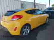 2013 Hyundai Veloster w/Black Int z VIN KMHTC6AD6DU094792, wystawiony jako IAAI lot #42772775 z przebiegiem 108 643 mil mil oraz . Historia ofert i sprzedaży dostępna na DreamBid. Obrazek 4.