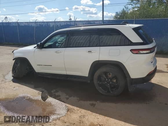 2023 Jeep Grand Cherokee Laredo with VIN 1C4RJHAG5PC508651, listed as a Copart auction lot 71157665 with 83,086 mi miles and Salvage title. Bid and sale history available at DreamBid. Image 2.