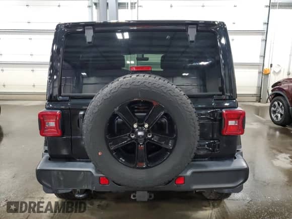 2023 Jeep Wrangler Sahara Altitude with VIN 1C4HJXEG9PW595565, listed as a Copart auction lot 77230394 with 28,477 mi miles and Salvage title. Bid and sale history available at DreamBid. Image 6.