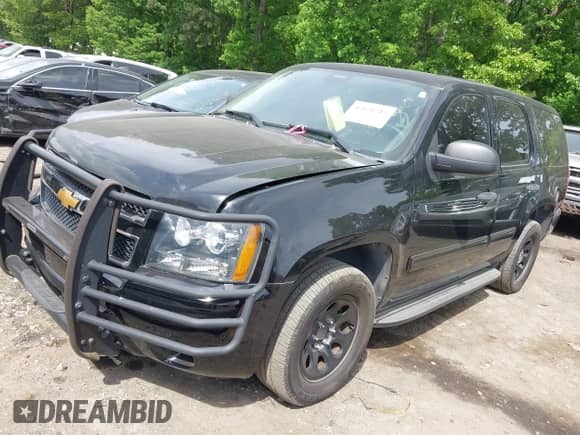 2014 Chevrolet Tahoe Commercial with VIN 1GNLC2E05ER164489, listed as a IAAI auction lot 42126712 with 192,159 mi miles and . Bid and sale history available at DreamBid. Image 2.