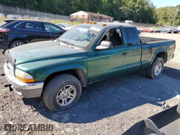 2003 Dodge Dakota z VIN 1D7HG42X63S185539, wystawiony jako Copart lot #73720794 z przebiegiem Nie podano mil oraz Szkoda całkowita • Salvage title. Historia ofert i sprzedaży dostępna na DreamBid. Obrazek 1.