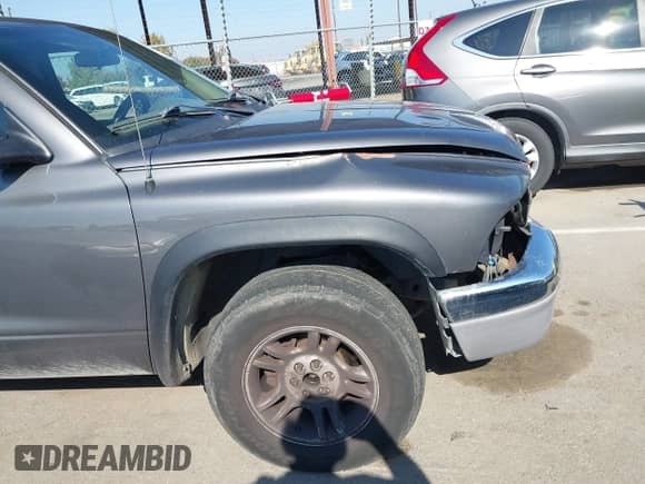 2004 Dodge Dakota SLT with VIN 1D7GL42K74S750961, listed as a IAAI auction lot 43475779 with 196,799 mi miles and . Bid and sale history available at DreamBid. Image 14.