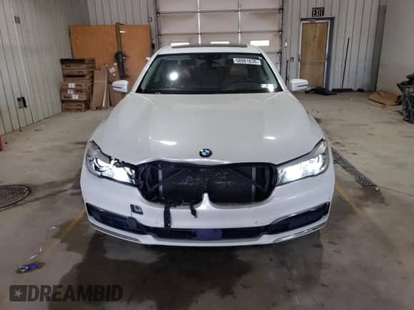 2017 BMW 7 Series 740e xDrive with VIN WBA7J2C38HG497960, listed as a Copart auction lot 58901035 with 128,262 mi miles and Salvage title. Bid and sale history available at DreamBid. Image 5.