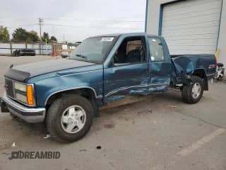 1992 GMC Sierra 1500 with VIN 2GTEK19K1N1537823, listed as a Copart auction lot 74952004 with 147,810 mi miles and Salvage title. Bid and sale history available at DreamBid. Image 1.