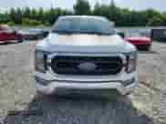 2023 Ford F-150 Lariat with VIN 1FTFW1E89PFA91516, listed as a Copart auction lot 61666315 with 65,711 mi miles and Salvage title. Bid and sale history available at DreamBid. Image 5.