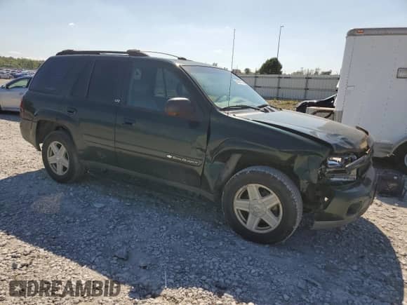2003 Chevrolet TrailBlazer LT with VIN 1GNDT13S232405711, listed as a Copart auction lot 84405135 with 184,070 mi miles and Salvage title. Bid and sale history available at DreamBid. Image 4.