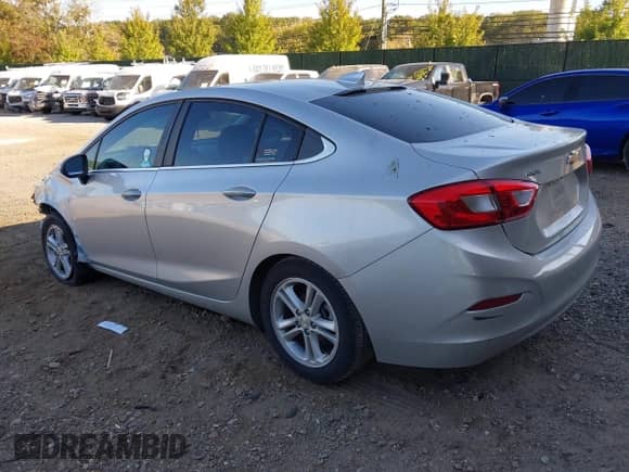 2018 Chevrolet Cruze LT with VIN 1G1BE5SM8J7171572, listed as a IAAI auction lot 43353283 with 104,514 mi miles and . Bid and sale history available at DreamBid. Image 3.