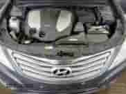 2013 Hyundai Azera z VIN KMHFH4JG2DA321197, wystawiony jako Copart lot #65585084 z przebiegiem 158 956 mil mil oraz Szkoda całkowita • Salvage title. Historia ofert i sprzedaży dostępna na DreamBid. Obrazek 11.