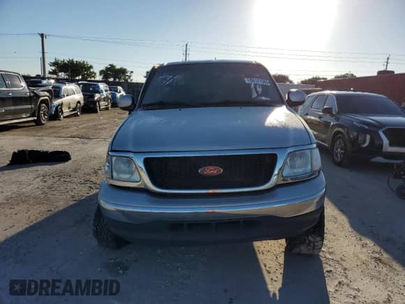 2003 Ford F-150 XLT z VIN 1FTRW08L23KB97346, wystawiony jako Copart lot #86121565 z przebiegiem Nie podano mil oraz Szkoda całkowita • Salvage title. Historia ofert i sprzedaży dostępna na DreamBid. Obrazek 5.