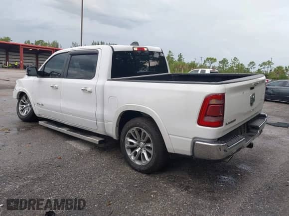2021 Ram 1500 Laramie with VIN 1C6RREJT5MN628655, listed as a IAAI auction lot 42734346 with 104,116 mi miles and . Bid and sale history available at DreamBid. Image 3.
