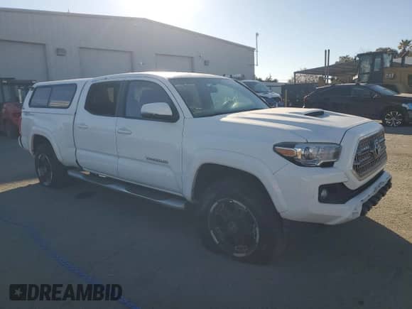 2016 Toyota Tacoma TRD Sport with VIN 3TMBZ5DN9GM001172, listed as a Copart auction lot 86475475 with 92,598 mi miles and Salvage title. Bid and sale history available at DreamBid. Image 4.