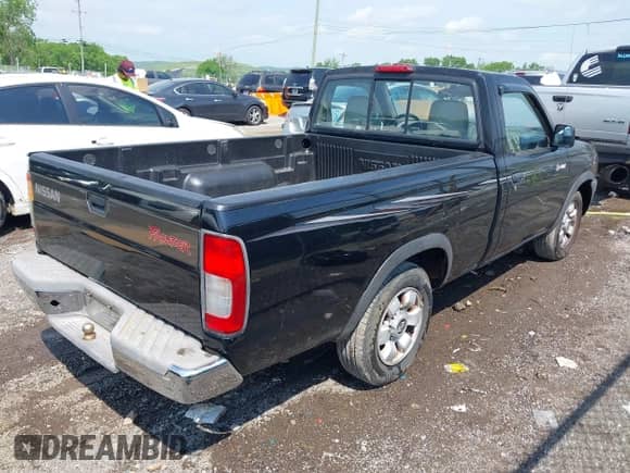 1998 Nissan Frontier XE with VIN 1N6DD21S5WC305516, listed as a IAAI auction lot 42128088 with Not provided miles and . Bid and sale history available at DreamBid. Image 4.