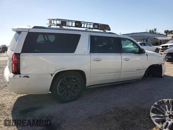 2015 Chevrolet Suburban LTZ with VIN 1GNSKKKC7FR303391, listed as a Copart auction lot 67794035 with 134,569 mi miles and Salvage title. Bid and sale history available at DreamBid. Image 3.