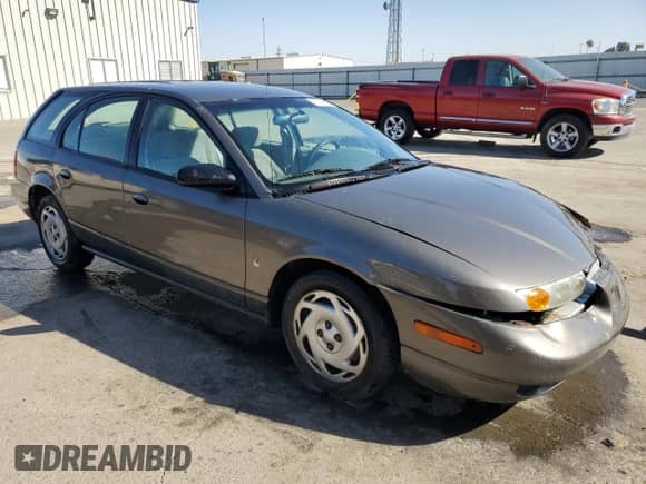 2000 Saturn SW with VIN 1G8ZN827XYZ131326, listed as a Copart auction lot 76143544 with 81,922 mi miles and Salvage title. Bid and sale history available at DreamBid. Image 4.