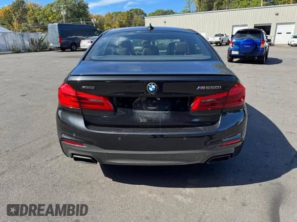 2018 BMW 5 Series M550i xDrive with VIN WBAJB9C5XJB035707, listed as a Copart auction lot 85534745 with 82,370 mi miles and Clean title. Bid and sale history available at DreamBid. Image 6.