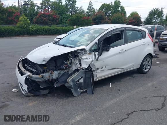 2012 Ford Fiesta SES with VIN 3FADP4FJ5CM183357, listed as a IAAI auction lot 42798122 with 147,657 mi miles and . Bid and sale history available at DreamBid. Image 2.