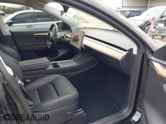 2024 Tesla Model Y with VIN 7SAYGDED8RF156984, listed as a IAAI auction lot 43324819 with 26,941 mi miles and . Bid and sale history available at DreamBid. Image 5.
