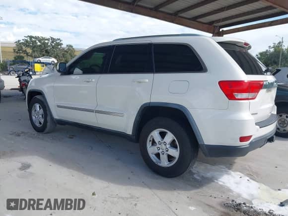 2012 Jeep Grand Cherokee Laredo z VIN 1C4RJEAG6CC227886, wystawiony jako IAAI lot #43547066 z przebiegiem 165 089 mil mil oraz . Historia ofert i sprzedaży dostępna na DreamBid. Obrazek 3.