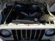 2006 Jeep Wrangler SE z VIN 1J4FA29S26P786255, wystawiony jako Copart lot #66142225 z przebiegiem 111 713 mil mil oraz Szkoda całkowita • Salvage title. Historia ofert i sprzedaży dostępna na DreamBid. Obrazek 11.