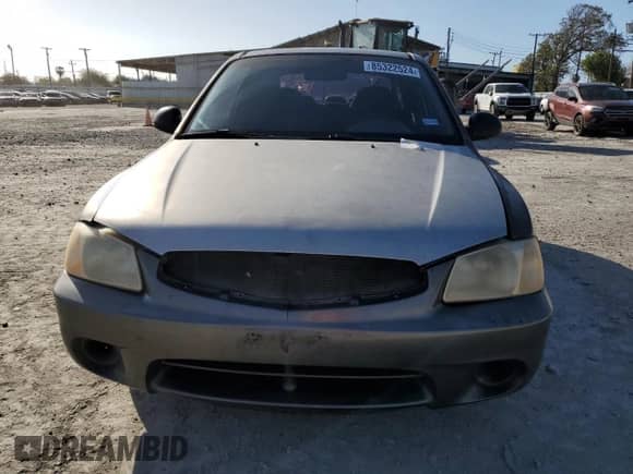 2002 Hyundai Accent GS z VIN KMHCG35C72U192411, wystawiony jako Copart lot #85322524 z przebiegiem 130 977 mil mil oraz Szkoda całkowita • Salvage title. Historia ofert i sprzedaży dostępna na DreamBid. Obrazek 5.