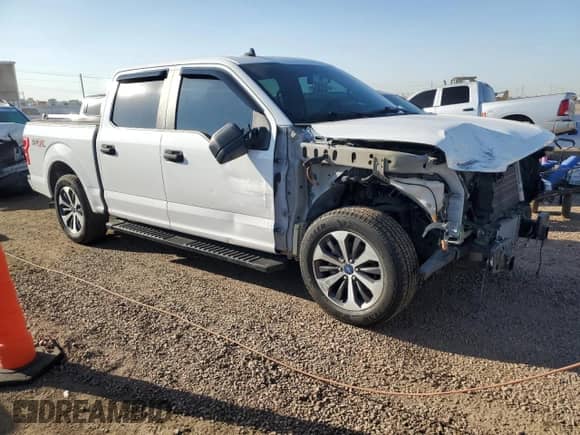 2020 Ford F-150 XL with VIN 1FTEW1CPXLFA15710, listed as a Copart auction lot 61944055 with 98,561 mi miles and Salvage title. Bid and sale history available at DreamBid. Image 4.