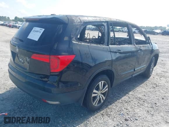 2017 Honda Pilot EX-L with VIN 5FNYF5H59HB020596, listed as a IAAI auction lot 42648974 with Not provided miles and . Bid and sale history available at DreamBid. Image 4.