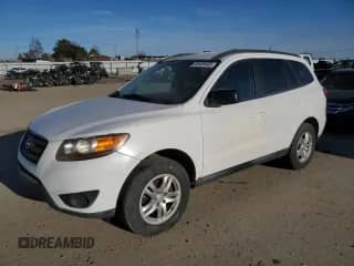 2012 Hyundai Santa Fe GLS с VIN 5XYZGDAG7CG156198, выставлен на аукционе Copart как лот 89409405 с пробегом 122 609 миль миль и Списание • Salvage title. История ставок и продаж доступна на DreamBid. Изображение 1.