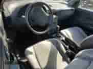 1995 Saturn SC with VIN 1G8ZE1285SZ141155, listed as a Copart auction lot 65757374 with 150,973 mi miles and Salvage title. Bid and sale history available at DreamBid. Image 8.