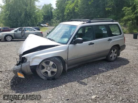1999 Subaru Forester S with VIN JF1SF6557XH730701, listed as a Copart auction lot 65169235 with 142,246 mi miles and Salvage title. Bid and sale history available at DreamBid. Image 1.