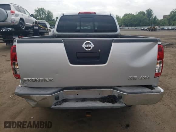 2009 Nissan Frontier SE with VIN 1N6AD06W79C408699, listed as a Copart auction lot 58698925 with 118,451 mi miles and Salvage title. Bid and sale history available at DreamBid. Image 6.
