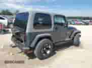 2005 Jeep Wrangler X z VIN 1J4FA39S65P325984, wystawiony jako Copart lot #84242945 z przebiegiem 103 045 mil mil oraz Szkoda całkowita • Salvage title. Historia ofert i sprzedaży dostępna na DreamBid. Obrazek 3.