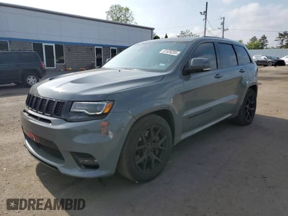2020 Jeep Grand Cherokee SRT with VIN 1C4RJFDJ8LC158048, listed as a Copart auction lot 57426205 with 52,979 mi miles and Salvage title. Bid and sale history available at DreamBid. Image 1.