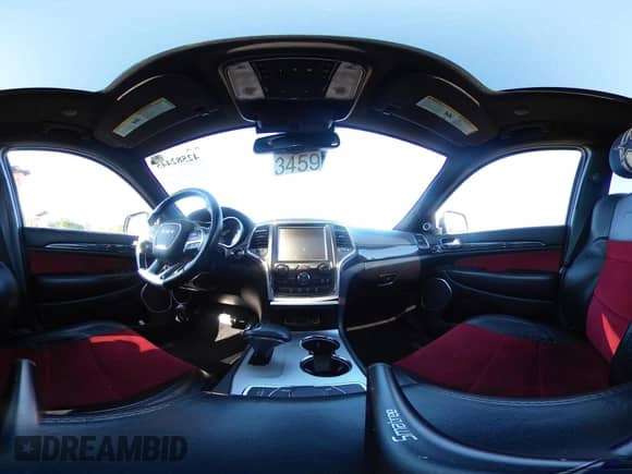 2015 Jeep Grand Cherokee SRT z VIN 1C4RJFDJ1FC717685, wystawiony jako IAAI lot #42582445 z przebiegiem 107 678 mil mil oraz . Historia ofert i sprzedaży dostępna na DreamBid. Obrazek 19.