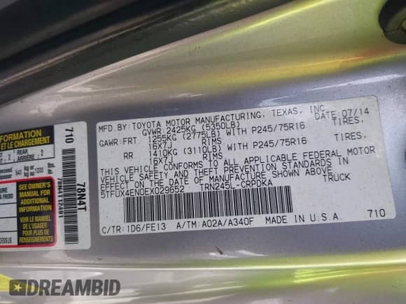 2014 Toyota Tacoma with VIN 5TFUX4EN0EX029652, listed as a IAAI auction lot 42150630 with 208,098 mi miles and . Bid and sale history available at DreamBid. Image 9.