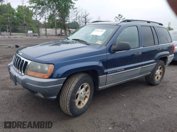 2002 Jeep Grand Cherokee Sport with VIN 1J4GW38S42C166263, listed as a IAAI auction lot 42521707 with 267,842 mi miles and . Bid and sale history available at DreamBid. Image 2.