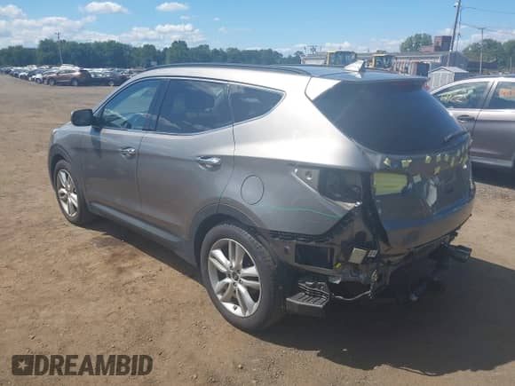 2015 Hyundai Santa Fe z VIN 5XYZWDLA4FG262429, wystawiony jako IAAI lot #43118323 z przebiegiem 105 391 mil mil oraz . Historia ofert i sprzedaży dostępna na DreamBid. Obrazek 6.