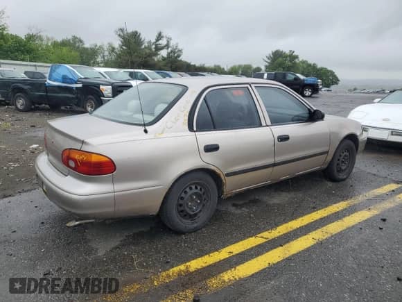 1999 Chevrolet Prizm z VIN 1Y1SK5284XZ403676, wystawiony jako Copart lot #57961725 z przebiegiem Nie podano mil oraz Szkoda całkowita • Salvage title. Historia ofert i sprzedaży dostępna na DreamBid. Obrazek 3.