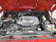 2014 Jeep Wrangler Sahara z VIN 1C4AJWBG0EL148282, wystawiony jako Copart lot #65809385 z przebiegiem 122 443 mil mil oraz Szkoda całkowita • Salvage title. Historia ofert i sprzedaży dostępna na DreamBid. Obrazek 11.