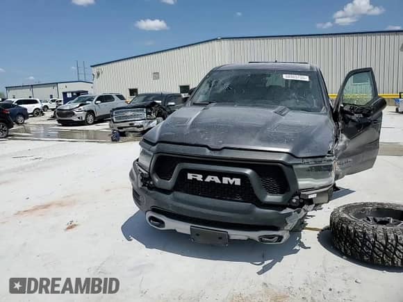 2020 Ram 1500 Rebel z VIN 1C6SRFLT2LN199221, wystawiony jako Copart lot #68965755 z przebiegiem 49 714 mil mil oraz Szkoda całkowita • Salvage title. Historia ofert i sprzedaży dostępna na DreamBid. Obrazek 14.