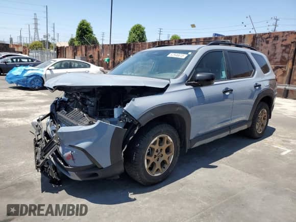 2024 Honda Pilot TrailSport with VIN 5FNYG1H61RB038185, listed as a Copart auction lot 62946615 with 5,883 mi miles and Salvage title. Bid and sale history available at DreamBid. Image 1.