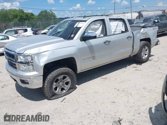 2014 Chevrolet Silverado 1500 LT z VIN 3GCUKREC9EG540582, wystawiony jako IAAI lot #42675516 z przebiegiem 157 998 mil mil oraz . Historia ofert i sprzedaży dostępna na DreamBid. Obrazek 2.