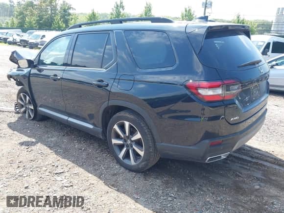 2024 Honda Pilot Touring with VIN 5FNYG1H77RB024994, listed as a IAAI auction lot 42672752 with 23,740 mi miles and . Bid and sale history available at DreamBid. Image 3.