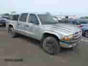 2003 Dodge Dakota Sport with VIN 1D7HG38N53S296504, listed as a IAAI auction lot 43349401 with 196,730 mi miles and . Bid and sale history available at DreamBid. Image 1.