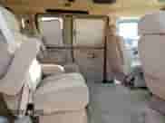 2004 Chevrolet Express Passenger z VIN 1GBFG15T541155274, wystawiony jako Copart lot #82241335 z przebiegiem 103 028 mil mil oraz Szkoda całkowita • Salvage title. Historia ofert i sprzedaży dostępna na DreamBid. Obrazek 11.