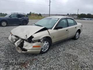 2000 Saturn SL with VIN 1G8ZH5283YZ221335, listed as a Copart auction lot 84196955 with 157,098 mi miles and Salvage title. Bid and sale history available at DreamBid. Image 1.