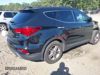 2017 Hyundai Santa Fe 2.4L z VIN 5NMZU3LB8HH018090, wystawiony jako IAAI lot #43356883 z przebiegiem 135 170 mil mil oraz . Historia ofert i sprzedaży dostępna na DreamBid. Obrazek 4.