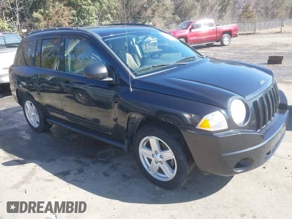 2010 Jeep Compass Sport z VIN 1J4NT1FB1AD624776, wystawiony jako IAAI lot #41571247 z przebiegiem 172 799 mil mil oraz . Historia ofert i sprzedaży dostępna na DreamBid. Obrazek 1.