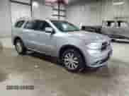 2014 Dodge Durango SXT with VIN 1C4RDJAG1EC381490, listed as a Copart auction lot 87370085 with 128,870 mi miles and Salvage title. Bid and sale history available at DreamBid. Image 4.