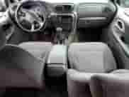 2003 Chevrolet TrailBlazer EXT LT z VIN 1GNET16S736180632, wystawiony jako Copart lot #63005465 z przebiegiem 155 862 mil mil oraz Szkoda całkowita • Salvage title. Historia ofert i sprzedaży dostępna na DreamBid. Obrazek 8.